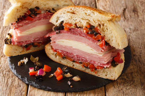 istock New Orleans original Muffaletta sandwich close up on a slate board. Horizontal 1266587567
