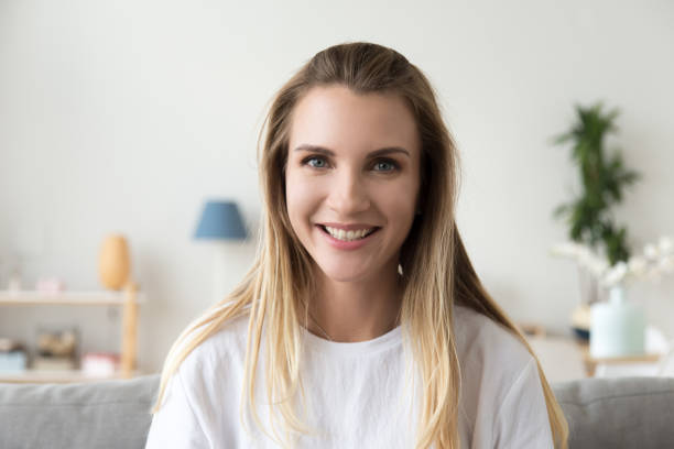 istock Attractive joyful millennial woman smiling looking at camera 1266588162