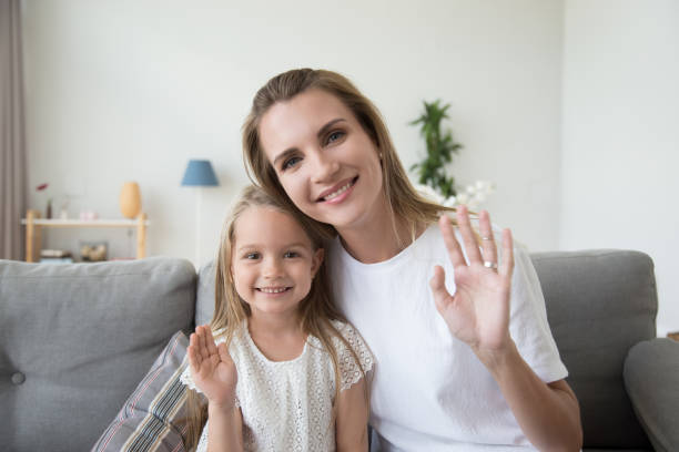 istock Happy mother and daughter smiling looking at camera 1266588165