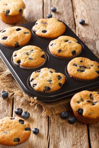 istock Delicious muffins with blueberries close-up in a baking dish. vertical 1266588364