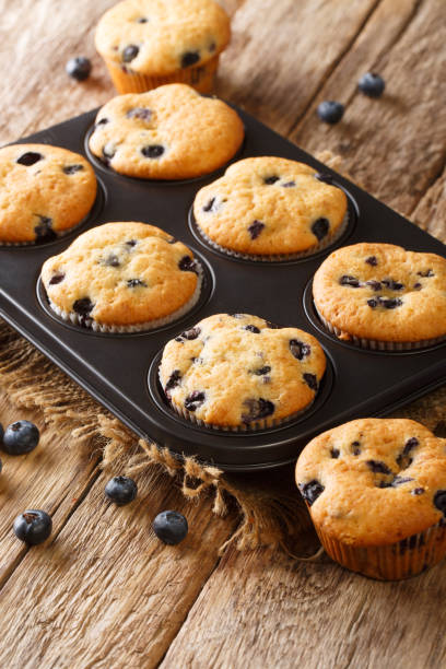 istock Diet berry muffins with blueberries close-up in a baking dish. vertical 1266588386