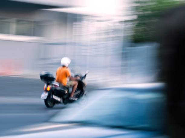 istock Boy on motorbike in motion 1266589634