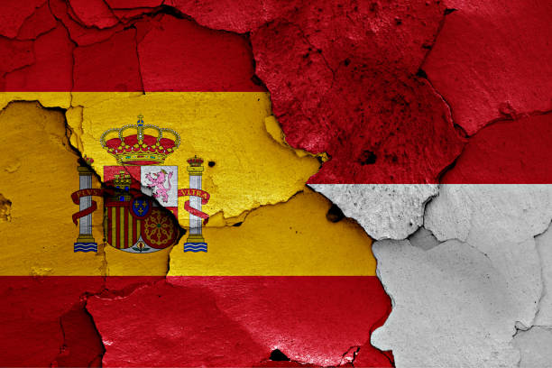 istock flags of Spain and Monaco painted on cracked wall 1266589663
