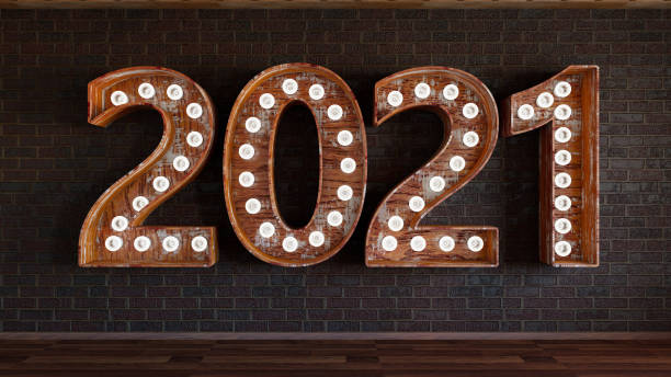 istock 2021 Bulb Sign On Black Brick Wall 1266589725