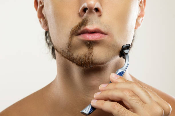 istock Male  face with a partially shaved beard 1266590085