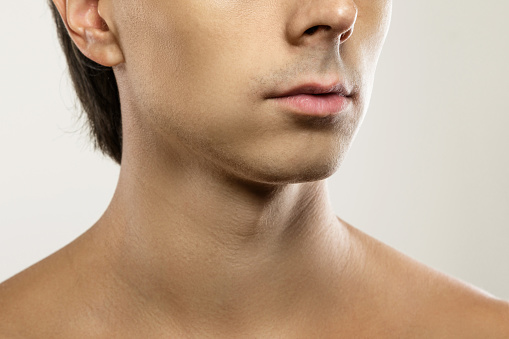 Men skin care and beauty. Closeup of clean-shaven male face.
