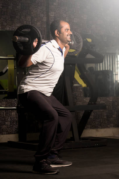 istock Go to gym & stay healthy.Coach doing exercise in gym... 1266590727