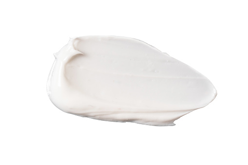 white cosmetic face cream texture on white background