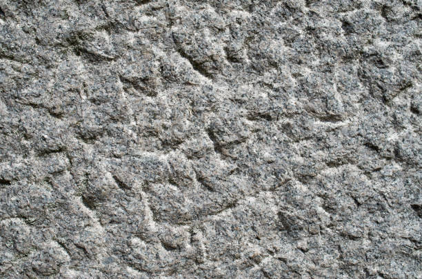 istock Roughly processed granite closeup in sunny day 1266591417