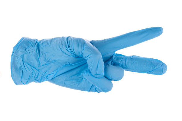istock Blue latex medical gloves  isolated on white background. 1266594748