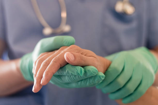 istock Surgeon, physician performs surgical operations, anesthetist or anesthesiologist holding patient's hand ffor checking state of mand or support in ER room, Medical healthcare concept 1266600929