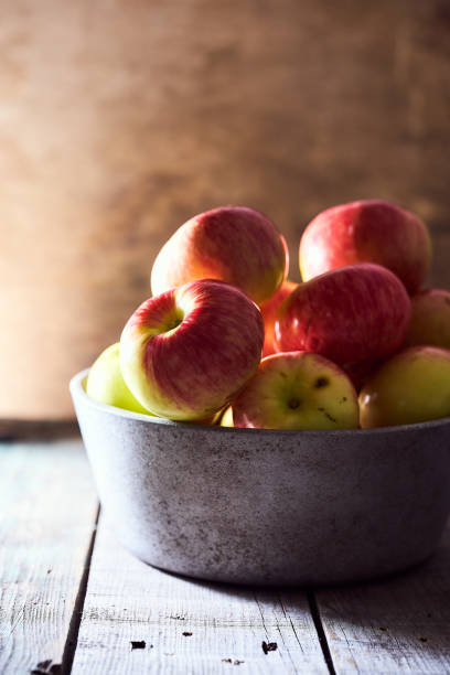 istock Composition of village red apples on a wooden table 1266603826