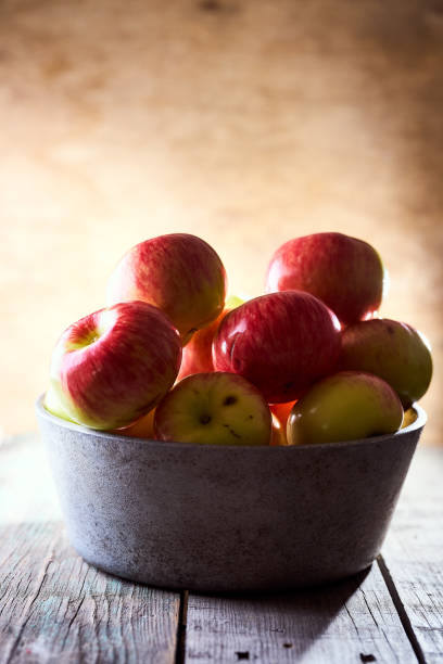 istock Composition of village red apples on a wooden table 1266603933