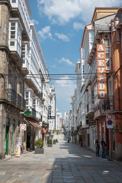 Few people unknown walk Real street at Ferrol stock photo