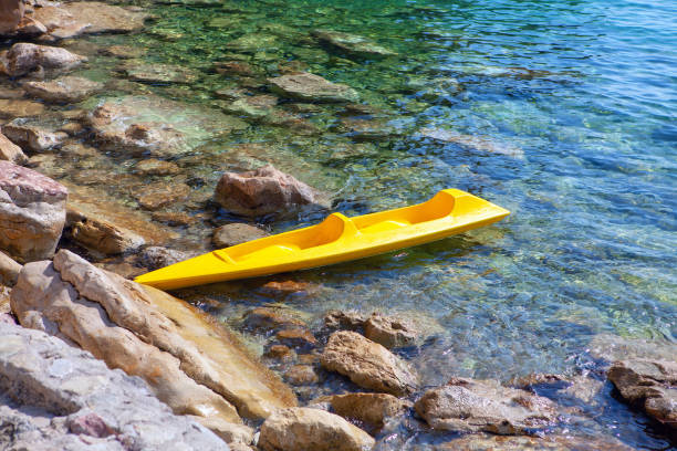 istock Tandem Kayak on the rocky seaside 1266605614