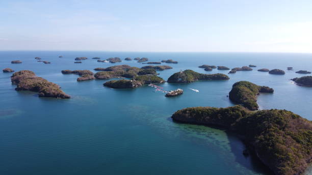 Aerial of Hundred Islands in Alaminos, Pangasinan, Philippines. It is a national park and a protected area. Aerial of Hundred Islands in Alaminos, Pangasinan, Philippines. It is a national park and a protected area. Drone shot. pangasinan stock pictures, royalty-free photos & images