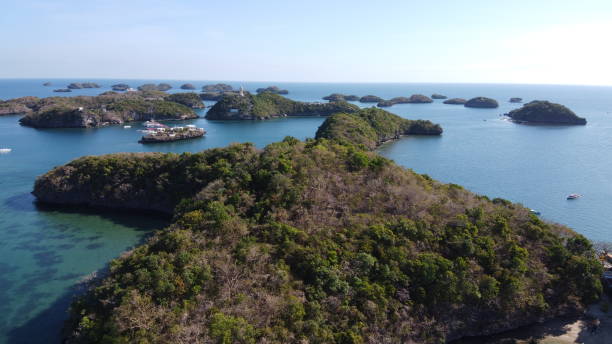 View of of Hundred Islands in Alaminos, Pangasinan, Philippines. It is a national park and a protected area. View of of Hundred Islands in Alaminos, Pangasinan, Philippines. It is a national park and a protected area. Aerial shot. Drone shot. pangasinan stock pictures, royalty-free photos & images