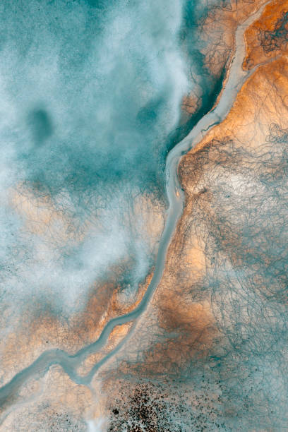 Aerial view of beautiful natural shapes and textures Aerial view of beautiful natural shapes and textures on lake which looks like an abstract painting. Taken via drone. lakeshore photos stock pictures, royalty-free photos & images