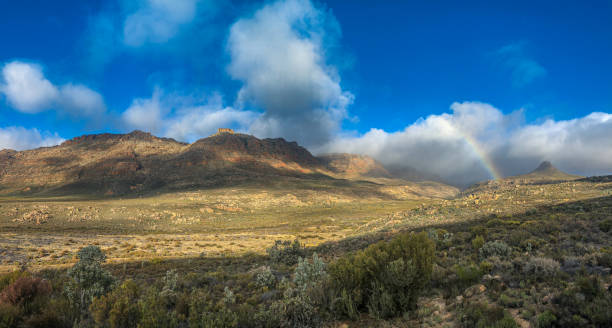 istock Kromrivier Cederberg Mountains Rainbow and Dramatic sky Pano 1266608731