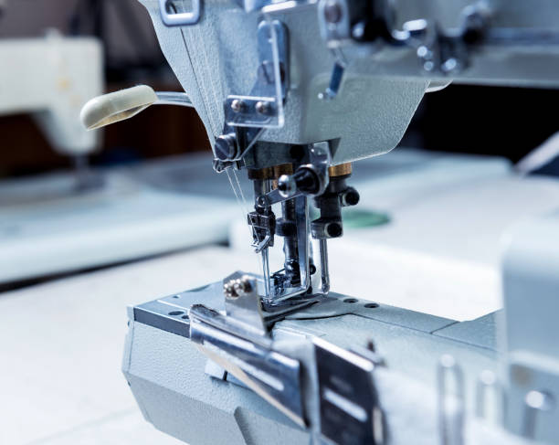 istock Fabric industry production line. Textile factory. Working tailoring process 1266609532