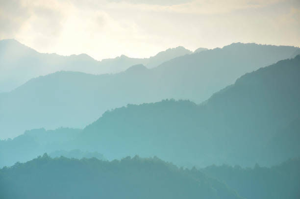 istock Misty mountains at sunrise 1266611241