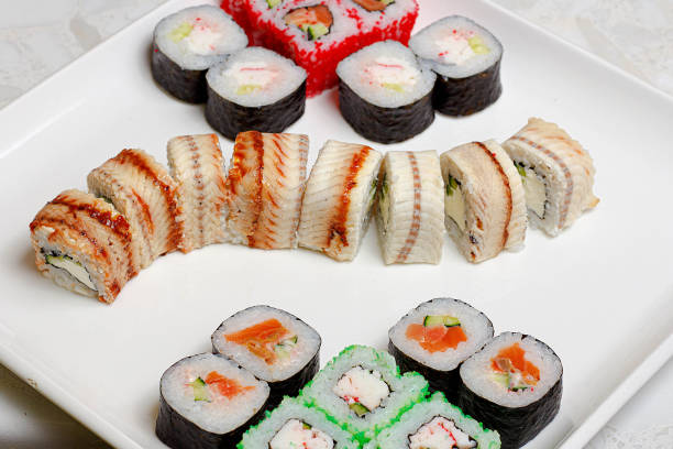istock set of different types of sushi on a white plate 1266613581