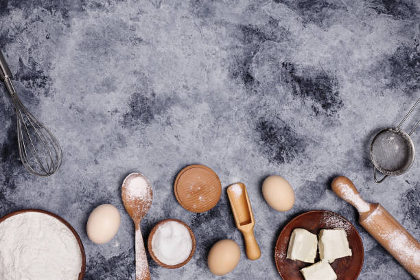 istock Eggs and flour and  on a dark background. 1266616322