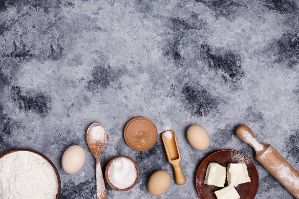 istock Eggs and flour and  on a dark background. 1266616323