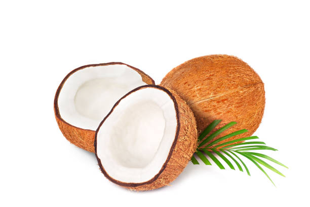 istock Coconut with half. Fresh raw coconut with palm leaves isolated on white background. 1266616693