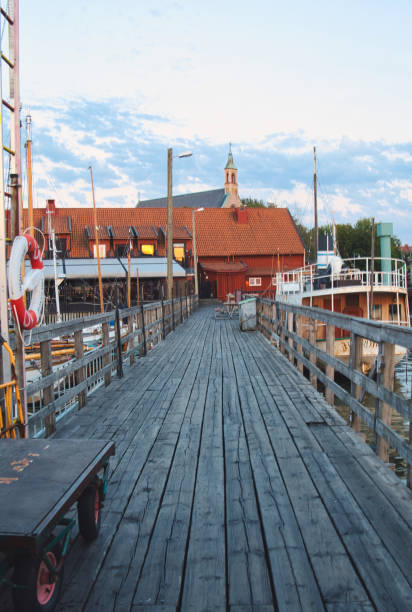 istock Landscape with a wooden pier in the harbor 1266618276