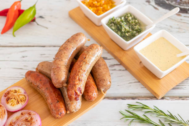 istock Grilled sausages with spices and sauces on the table 1266620268