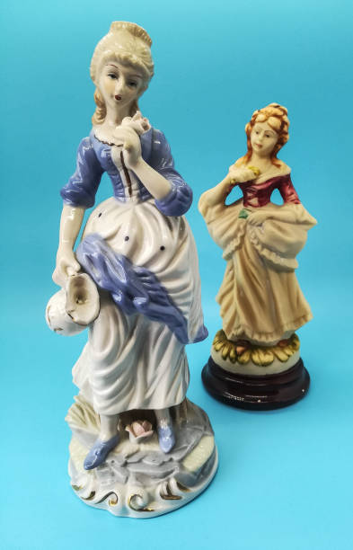 istock Ceramic figures of people on blue background 1266621043