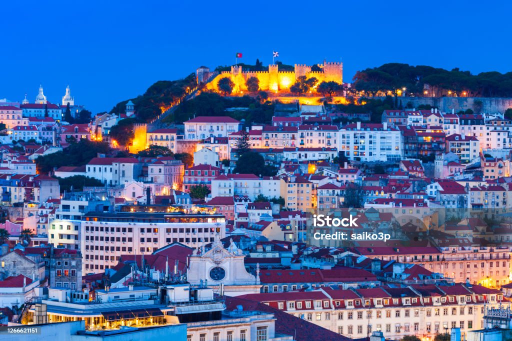 Saint George Castle in Lisbon, Portugal Saint George Castle or Castelo de Sao Jorge is a historic castle in the centre of Lisbon city in Portugal at sunset Prince George of Wales Stock Photo
