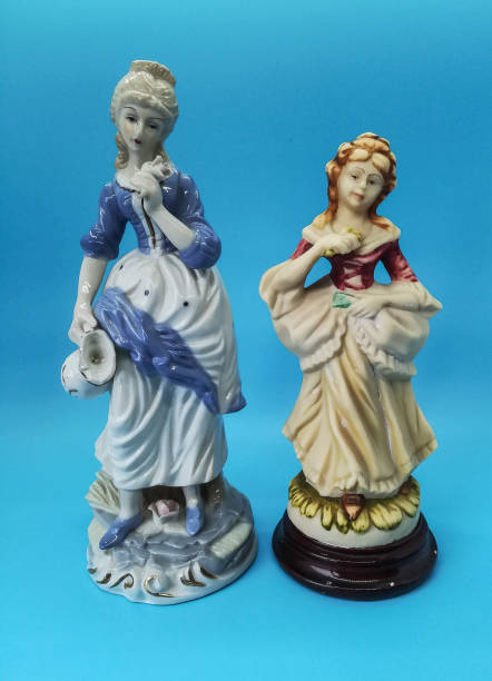 istock Ceramic figures of people on blue background 1266622949