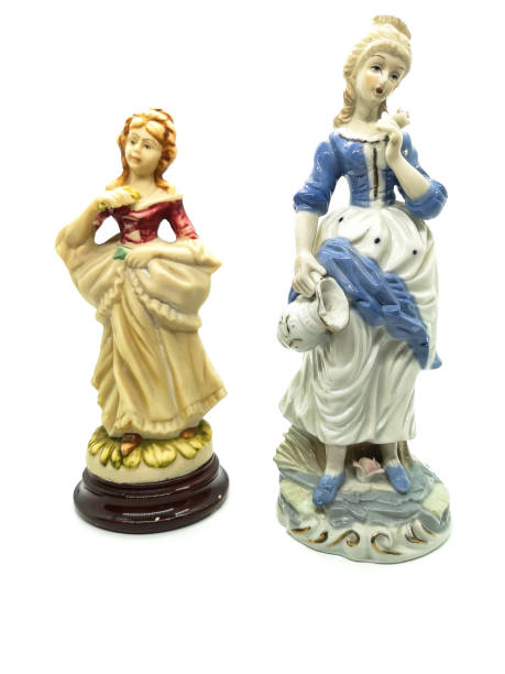 istock Ceramic figures of people on white background 1266625879