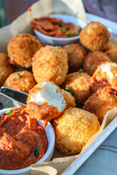 istock Fried cheese balls with tomato dipping sauce 1266626015