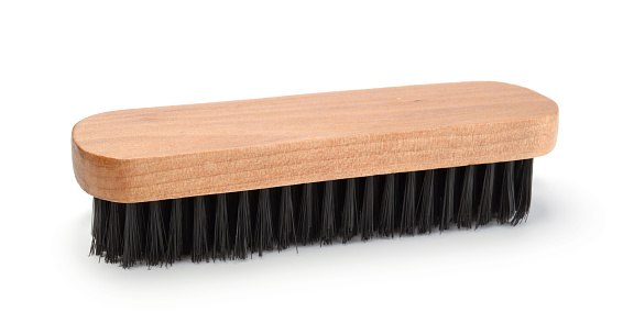 Wooden clothes brush isolated on white.
