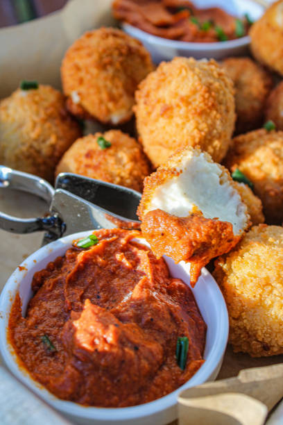 istock Fried cheese balls with tomato dipping sauce 1266626405