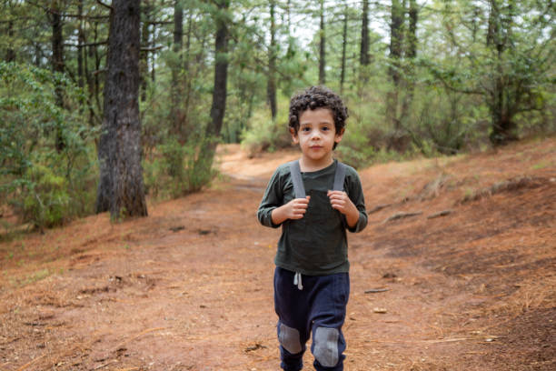 Child walking in the woods