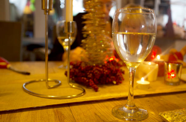 istock glass of wine on christmas table 1266630328