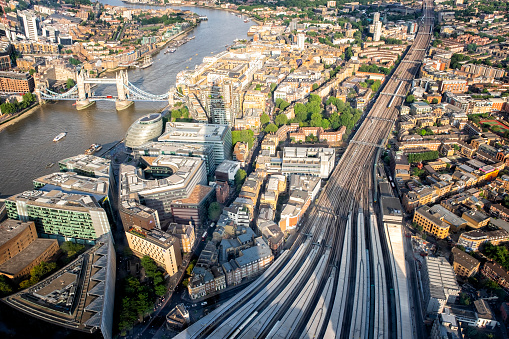aerial sunset view of London Bridge train station overlooking Thames river and Bridge Tower in London