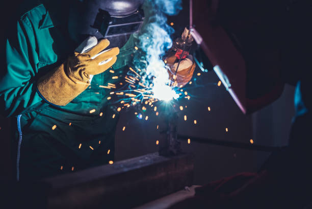 istock Metal welding steel works using electric arc welding machine 1266631537