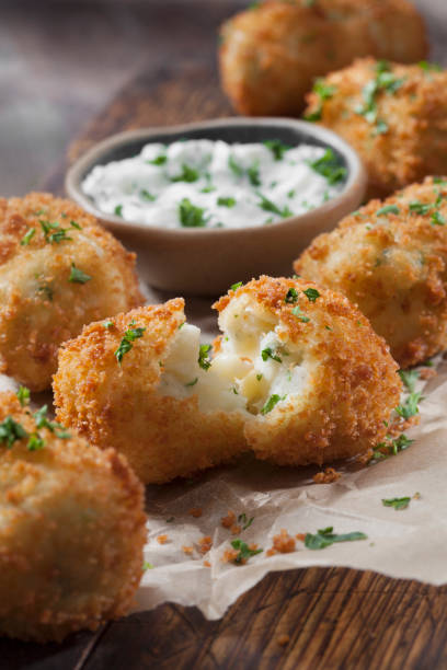 istock Creamy Mashed Potato Croquettes with Cheese and Sour Cream Dip 1266632772
