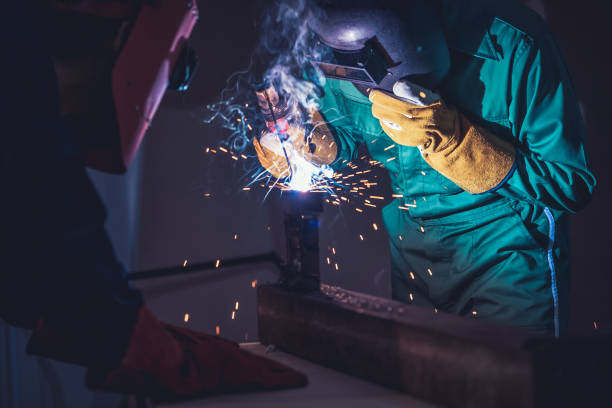 istock Metal welding steel works using electric arc welding machine 1266633931