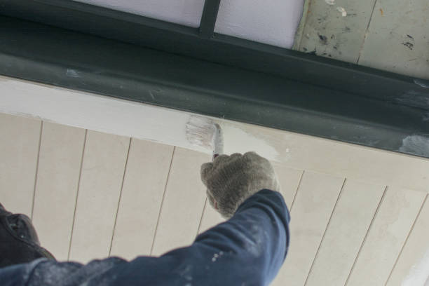 istock Man painting ceiling with white color 1266634351