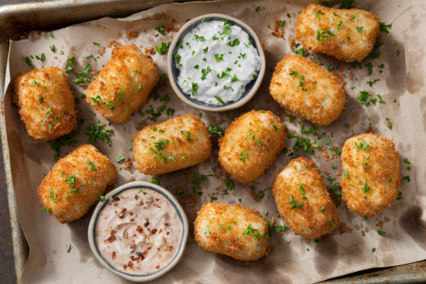 Creamy Mashed Potato Croquettes with Cheese and Sour Cream Dip Creamy Mashed Potato Croquettes with Cheese and Sour Cream Dip fried potato stock pictures, royalty-free photos & images