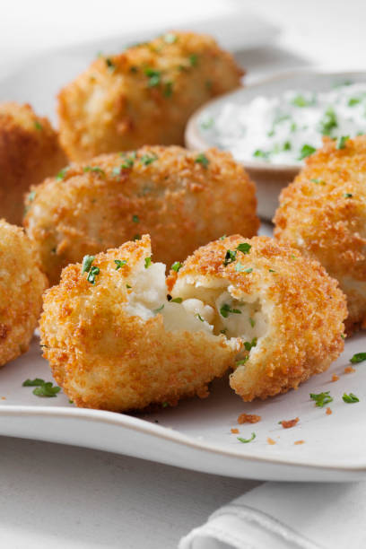 istock Creamy Mashed Potato Croquettes with Cheese and Sour Cream Dip 1266637222