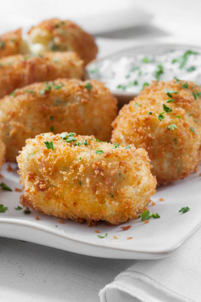 istock Creamy Mashed Potato Croquettes with Cheese and Sour Cream Dip 1266637242