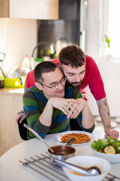 istock Leaning on his boyfriend from behind before lunch 1266638584