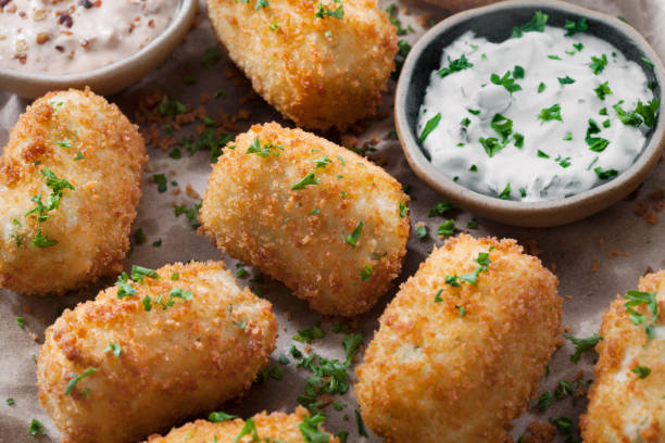 istock Creamy Mashed Potato Croquettes with Cheese and Sour Cream Dip 1266639941